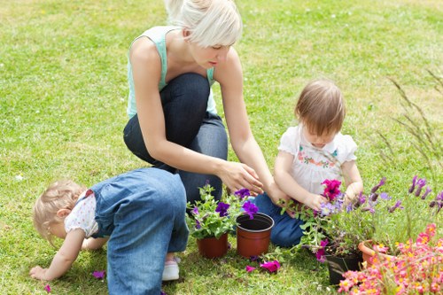 Lawn mowing service working on a green Eltham backyard